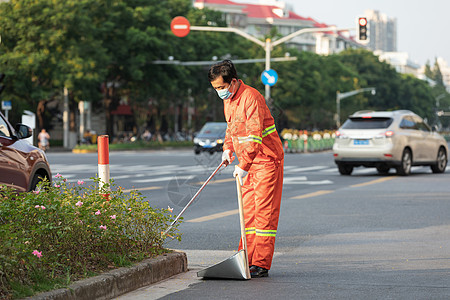 户外打扫城市街道的环卫工人背景图片