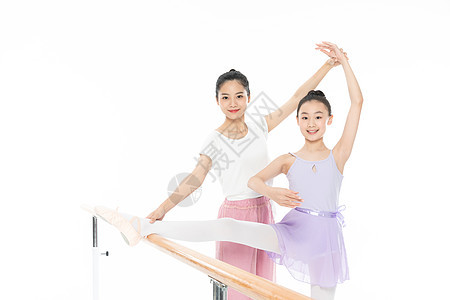 舞蹈老师帮助青少年学生压腿图片
