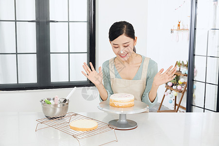 糕点制作女性手工制作奶油蛋糕背景