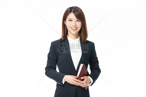 手拿书本的女律师图片