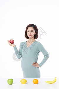 怀孕的人手拿苹果图片