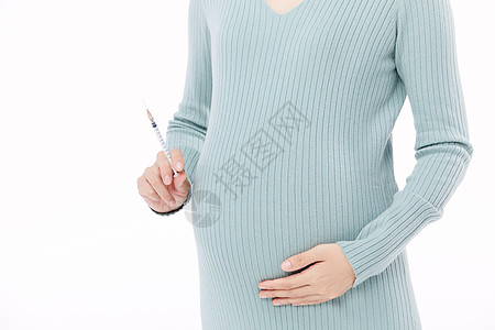 妊娠高血压孕妇拿着注射器近景背景