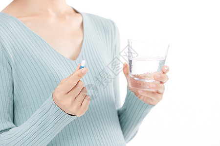 孕妇图标年轻女性孕妇拿着水杯准备吃药背景