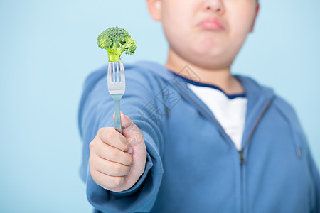 不喜欢吃花菜的胖子挑食的男孩图片