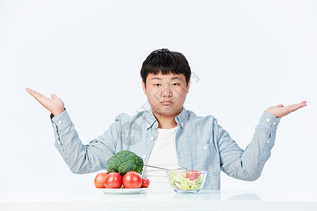 讨厌吃蔬菜水果的肥胖小男孩图片