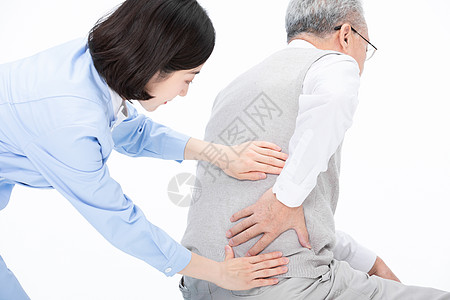 腰疼的老人护士帮老人按摩腰部背景