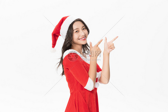 甜美女性戴圣诞帽欢庆圣诞图片