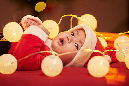 圣诞帽装饰圣诞节与可爱圣诞宝宝背景