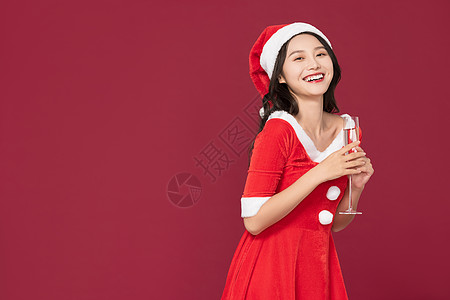 甜美清纯圣诞装扮美女喝香槟图片