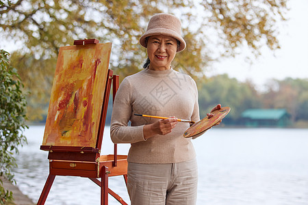 秋季安逸老人公园里绘画油画背景图片