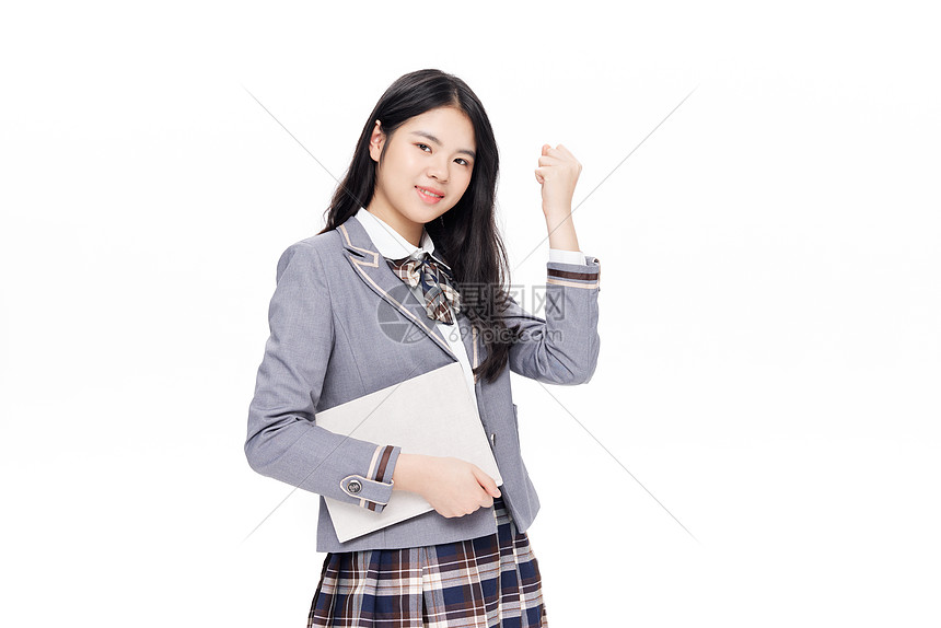 手捧书本的中学生加油手势