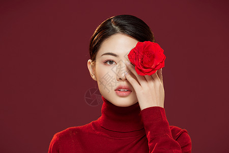 美女彩妆新年春节中国风美女拿玫瑰花背景