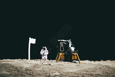 手绘太空宇航员太空登月创意小人微距背景