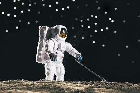 太空登月宇航员微距背景图片