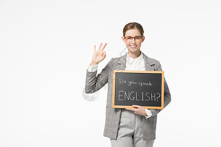 英语外教单手托着小黑板做ok手势背景图片
