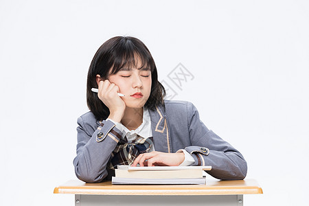 上课打瞌睡的大学生图片素材