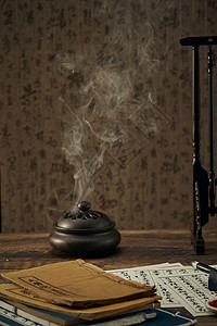 中国风笔墨纸砚古书籍和香炉背景