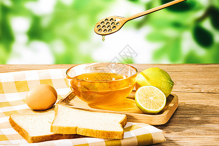 养生产品木桌上的蜂蜜和蜂蜜水背景