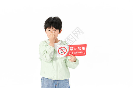 举着禁烟标识的小男孩捂着鼻子背景图片