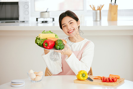 情人节美食周末居家做美食的年轻女性背景