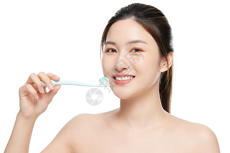美女刷牙口腔护理牙齿健康背景图片