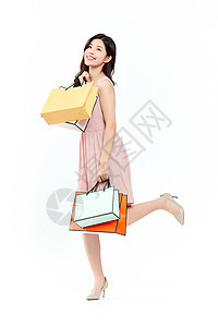 时尚购物女性拎购物袋背景图片