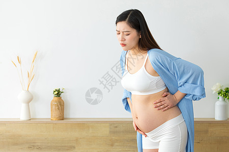 弯腰难受的孕妇图片