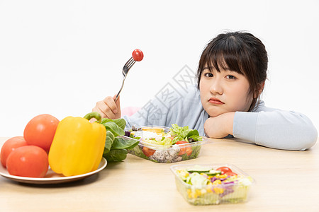 吃蔬菜讨厌吃水果蔬菜的肥胖女性背景