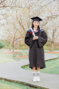 女大学生毕业照女大学生公园花季毕业照背景