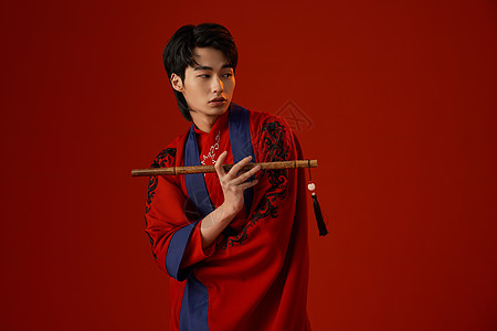 笛材古风国潮帅哥手持笛子背景