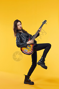 摇滚女孩激情弹电吉他背景图片