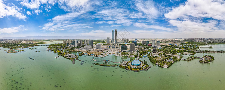 航拍蓝天白云下的宁夏银川阅海湾cbd金融中心背景图片