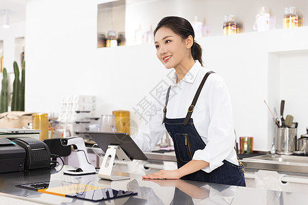 饮品店前台女性服务员图片