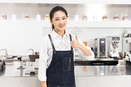 饮品店前台女性服务员点赞高清图片