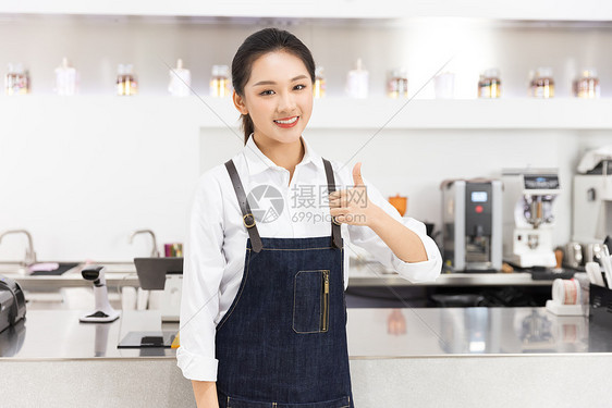 饮品店前台女性服务员点赞图片