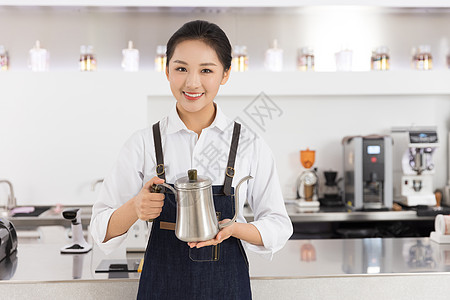 女服务员手拿咖啡壶图片