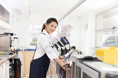 饮品店前台女性服务员图片