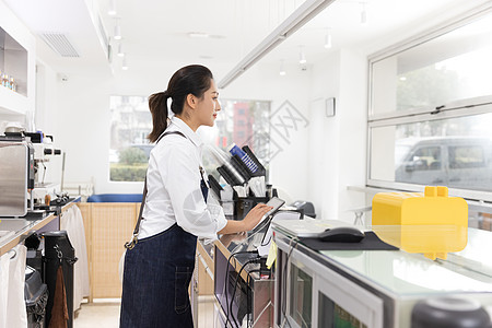 饮品店前台女性服务员图片