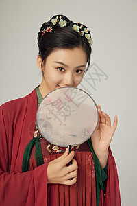 女人扇手拿扇子半遮面的古装美女背景