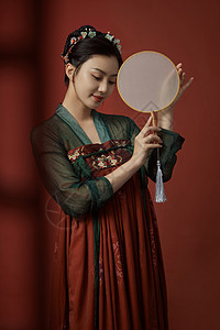 女人扇手拿扇子的古装美女微笑背景