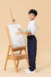 少儿艺术手拿调色盘画画的小男孩背景