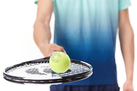 手持网球拍特写背景图片