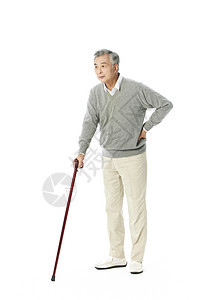 老年人拄着拐杖行走背景图片