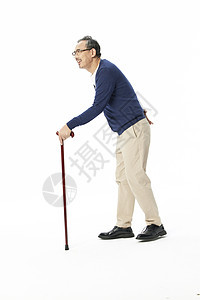 老年人拄着拐杖行走背景图片