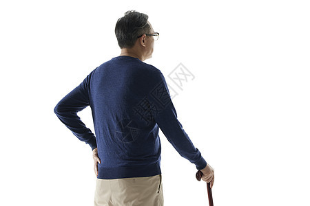 老年男性拄着拐杖背影背景图片