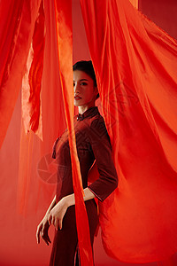 丝绸飘带红色飘带背景中的旗袍美女形象背景