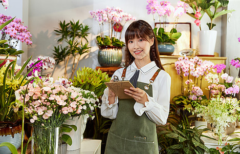 鲜花店美女销售员手写订单图片