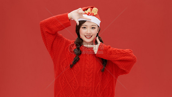 戴圣诞帽的年轻女孩图片