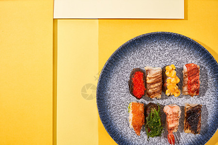 创意撞色多彩寿司背景图片