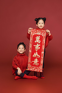 春节拜年新年春节双胞胎女孩拜年作揖背景